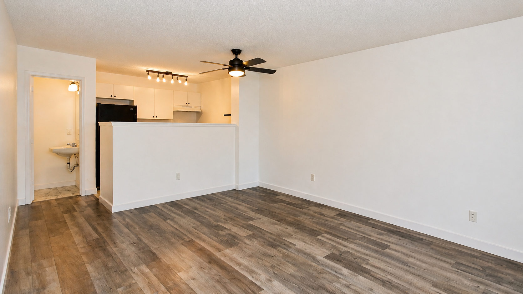 Bright open living room with hardwood floors